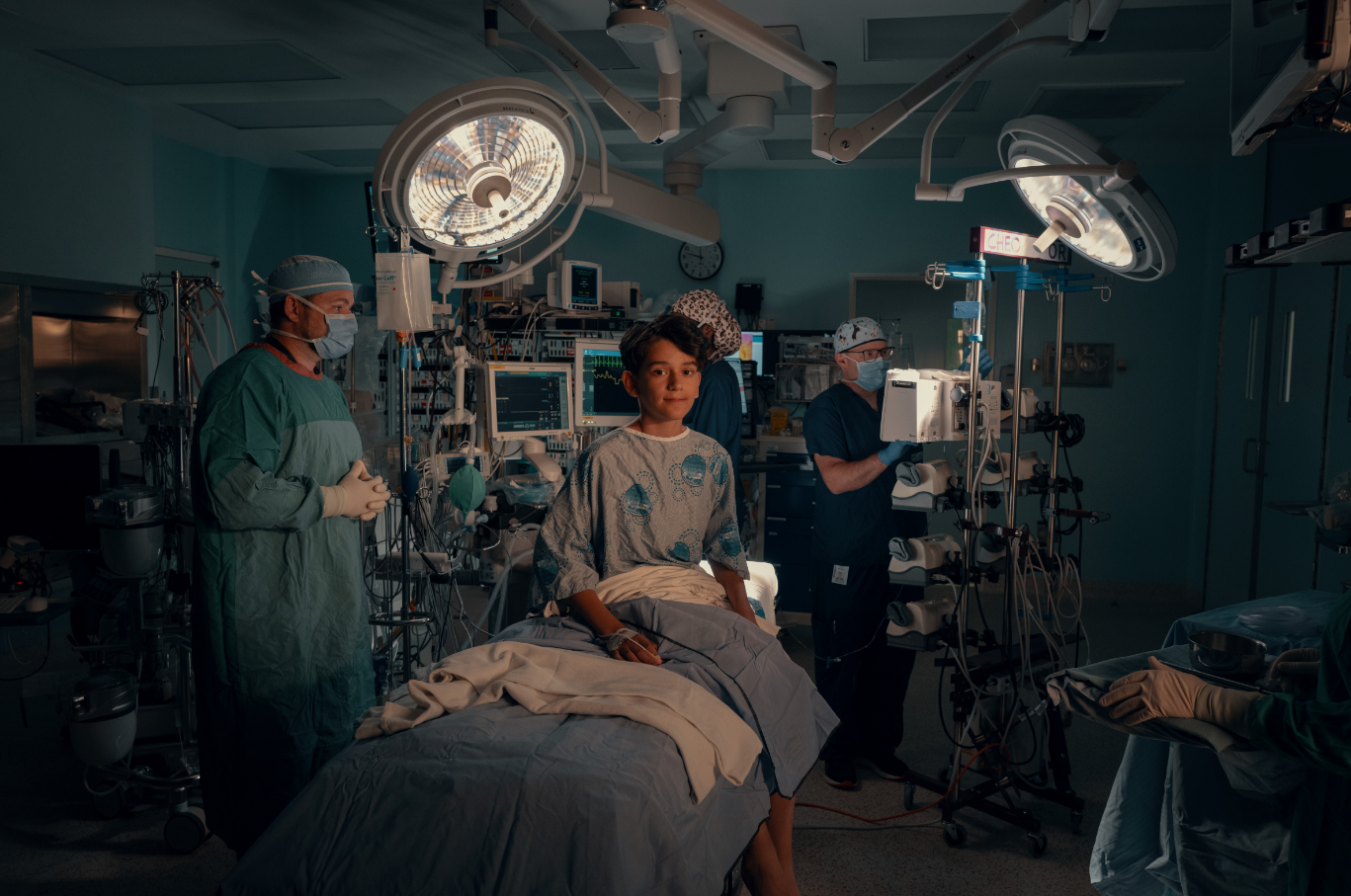 A young child on a hospital bed.