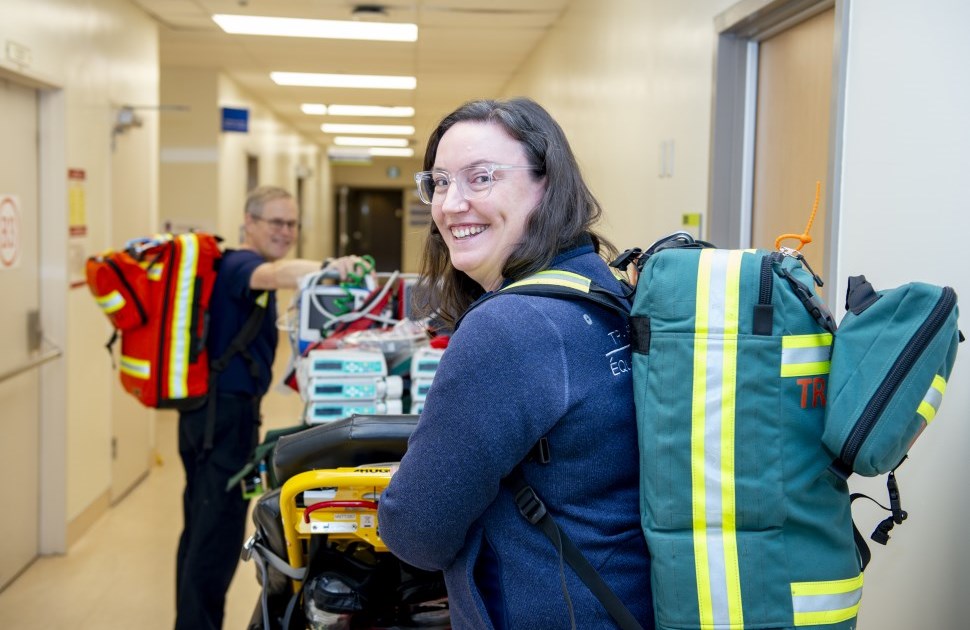 Transport Team members walking through the hallway with their equipment