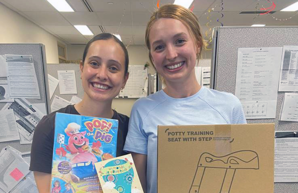 cheo staff members hold items gifted to them by family of child they treated
