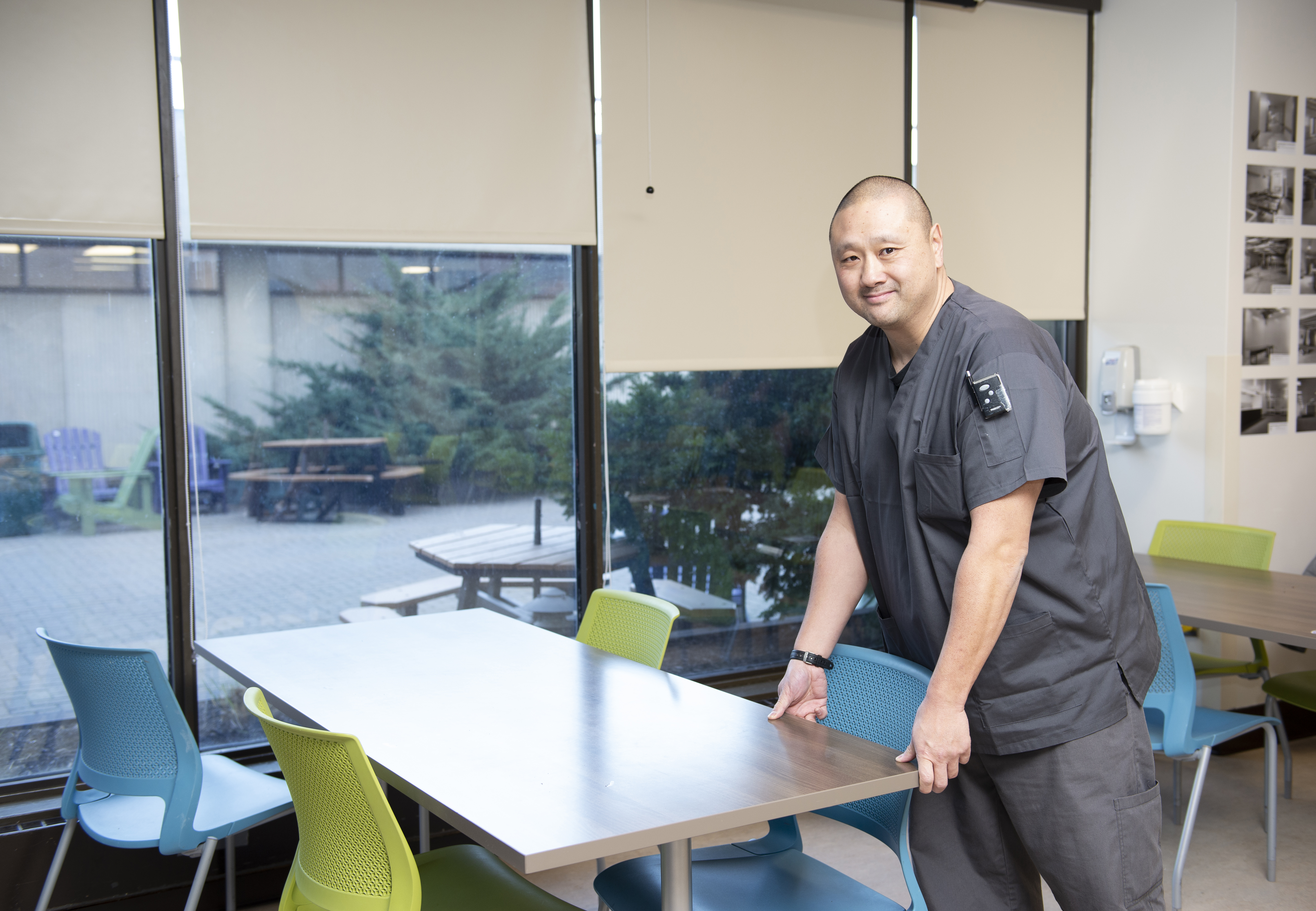 A man in grey scrubs