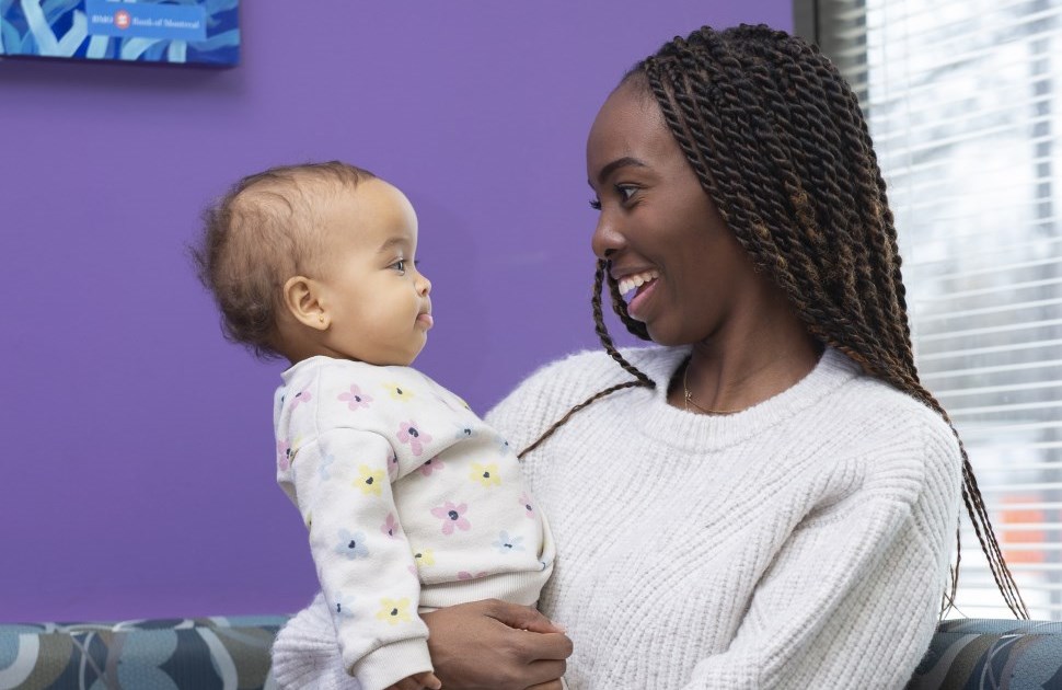 mom and one-year-old look at each other at cheo